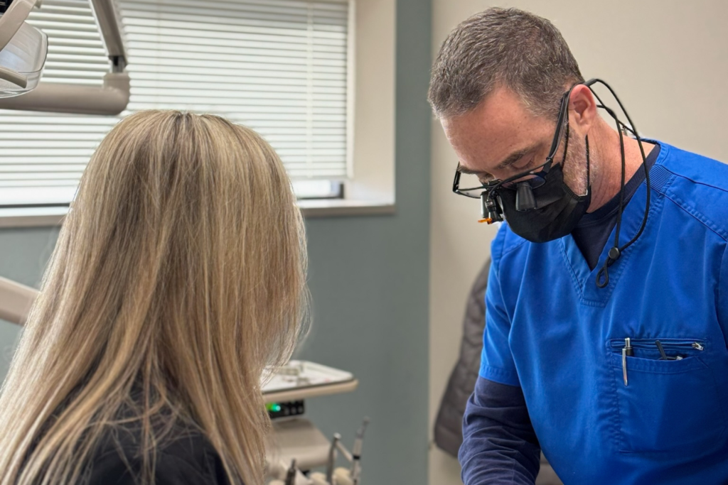 Dr. Wiles and his assistant performing a dental procedure