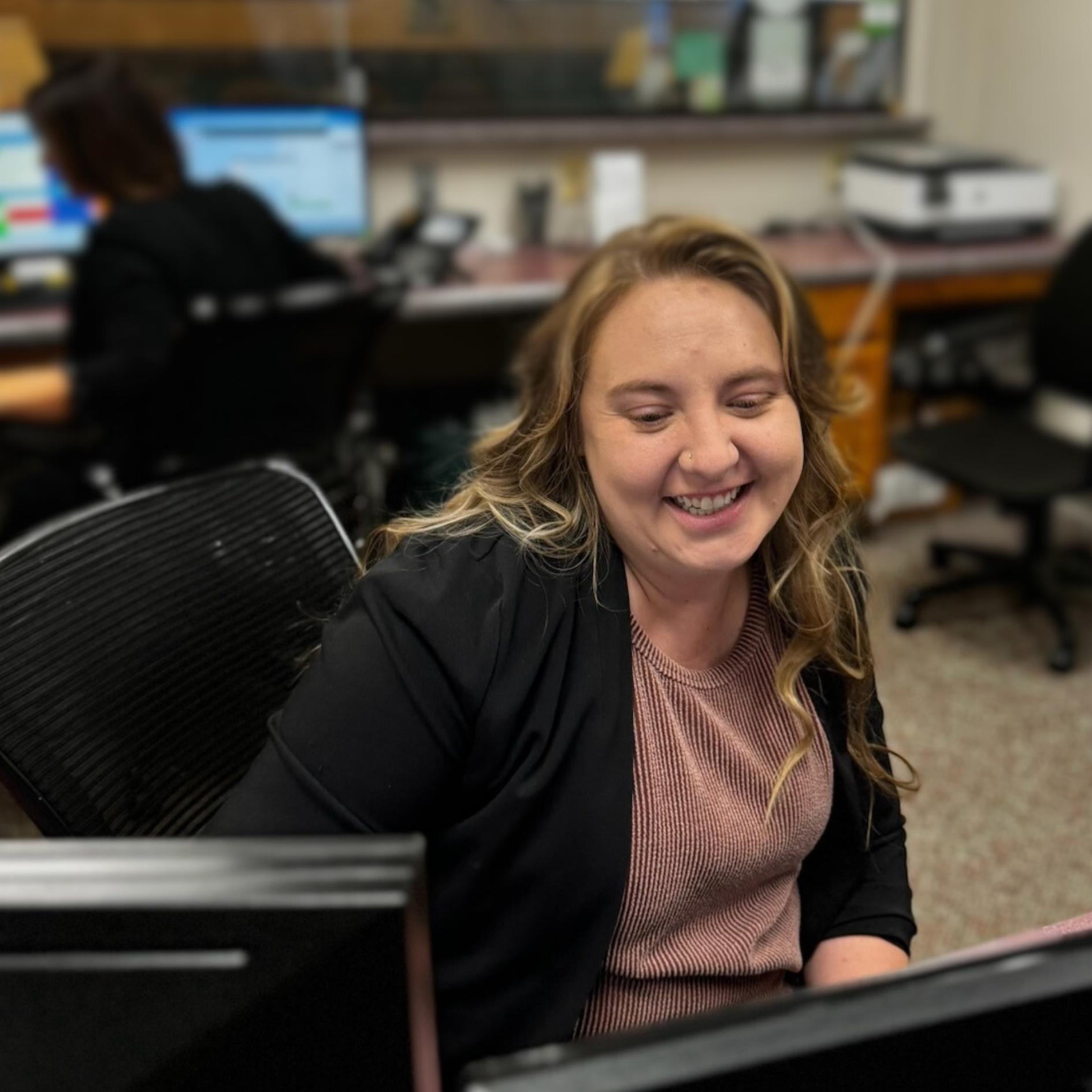 Practice Manager Shyann at the front desk